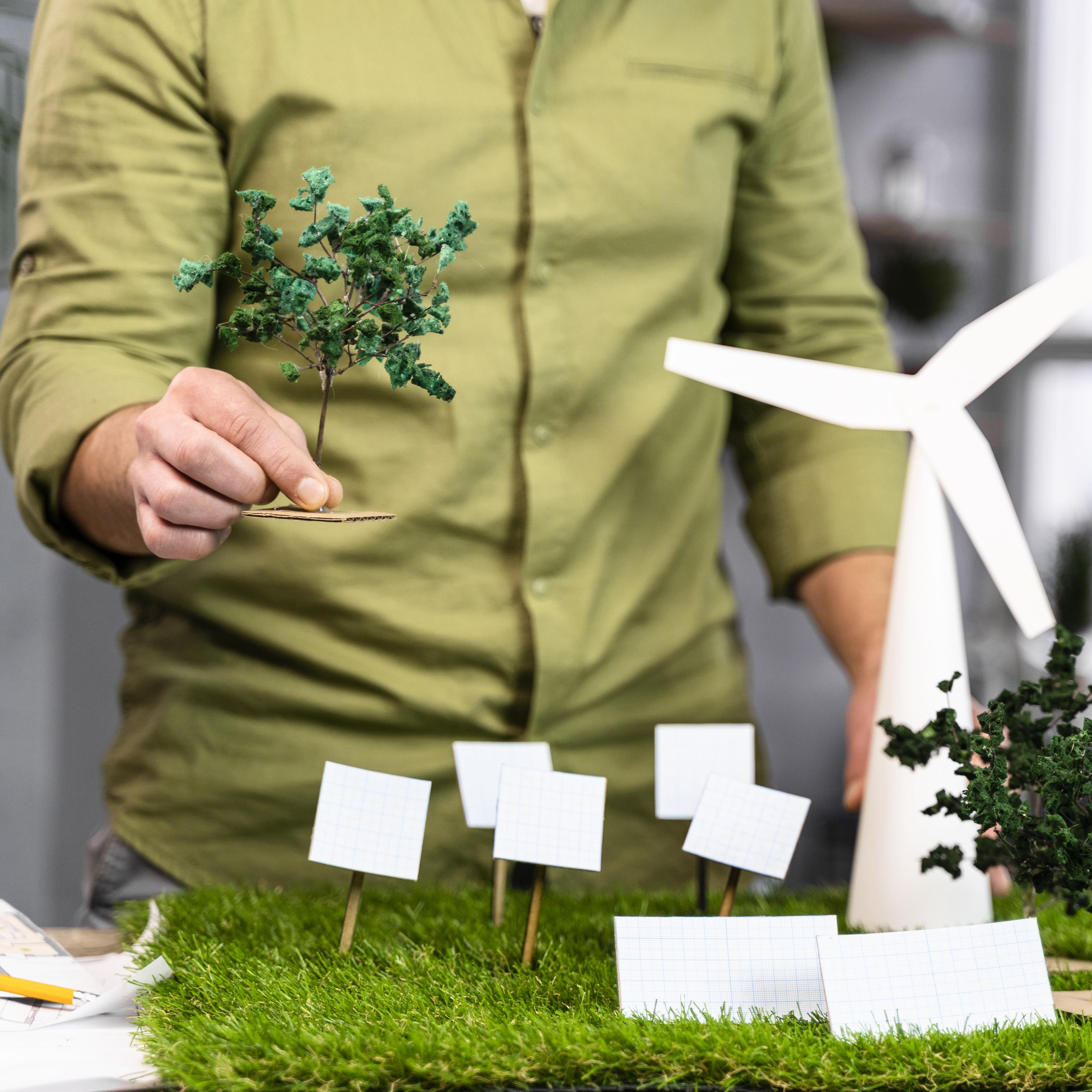 front-view-man-working-eco-friendly-wind-power-project-layout-with-wind-turbines